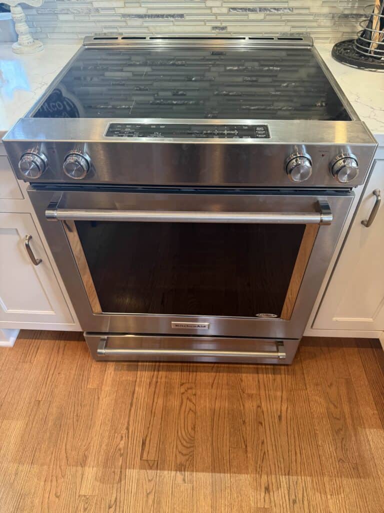 Modern stainless steel oven illustrating appliance durability and importance of understanding lifespan & repair timing for kitchens.