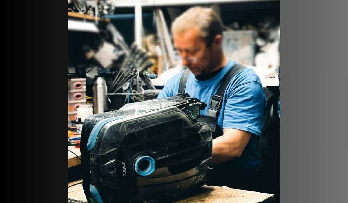 A trusted repair technician disassembling a home appliance during a professional diagnostics session—representing a top-rated appliance repair company near me